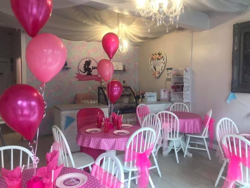 Inside the Perfect Parteas tea room — dressed party tables and balloons at our Manchester venue